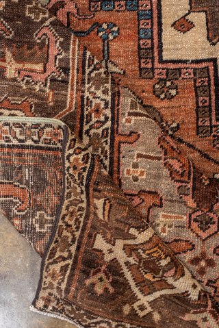 Antique Persian Serapi Carpet, circa 1900. Featuring a bold geometric medallion on a warm rust field with soft blue and ivory accents, framed by a classic Heriz-style border. Strong Northwest Persian design  ...