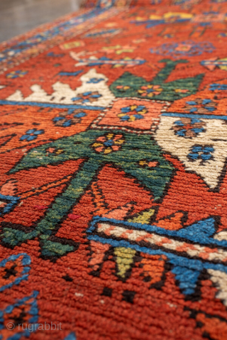 Antique Persian Heriz Runner, circa 1910. Featuring bold geometric medallions on a vibrant red field with blue and ivory accents, framed by a classic Heriz border. Strong Northwest Persian village design with  ...