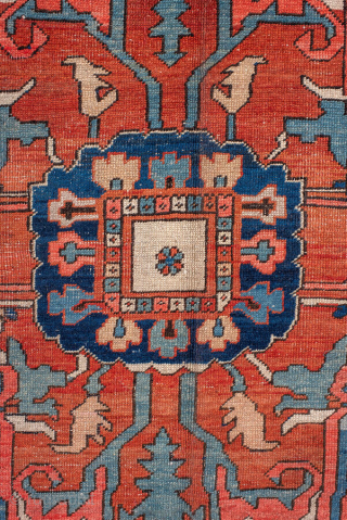 Antique Persian Serapi Carpet, circa 1900. Featuring a bold geometric medallion on a warm coral field with ivory and deep indigo accents, framed by a classic Heriz-style border. Grand Northwest Persian design  ...