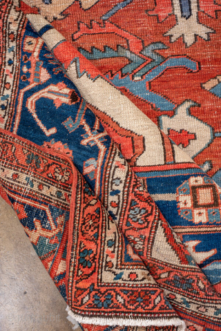 Antique Persian Serapi Carpet, circa 1900. Featuring a bold geometric medallion on a warm coral field with ivory and deep indigo accents, framed by a classic Heriz-style border. Grand Northwest Persian design  ...