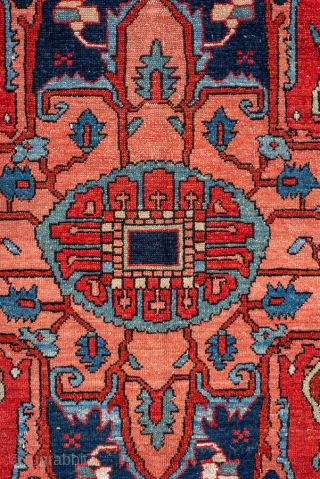Antique Persian Serapi Carpet, circa 1900. Featuring a bold geometric medallion on a richly saturated red field, accented by deep navy, ivory, and soft sky-blue tones. The spacious composition is filled with  ...