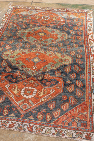 Antique Kurdish Rug, circa 1920. Featuring bold geometric medallions on a softly abrash blue-gray field with warm rust, ivory, and soft green accents, surrounded by a lively tribal border.

Item No. 101578

4'4" x  ...