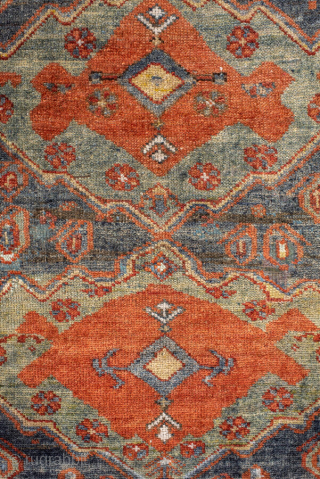Antique Kurdish Rug, circa 1920. Featuring bold geometric medallions on a softly abrash blue-gray field with warm rust, ivory, and soft green accents, surrounded by a lively tribal border.

Item No. 101578

4'4" x  ...