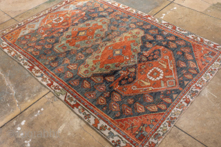 Antique Kurdish Rug, circa 1920. Featuring bold geometric medallions on a softly abrash blue-gray field with warm rust, ivory, and soft green accents, surrounded by a lively tribal border.

Item No. 101578

4'4" x  ...