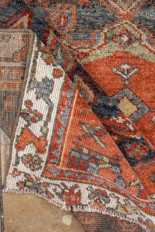 Antique Kurdish Rug, circa 1920. Featuring bold geometric medallions on a softly abrash blue-gray field with warm rust, ivory, and soft green accents, surrounded by a lively tribal border.

Item No. 101578

4'4" x  ...