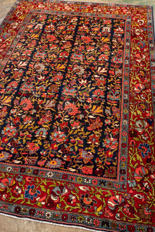 Antique Persian Bidjar Rug, circa 1920. Featuring an allover floral design on a deep navy field with vibrant red borders and richly saturated jewel tones throughout. Dense, finely drawn patterning and exceptional  ...
