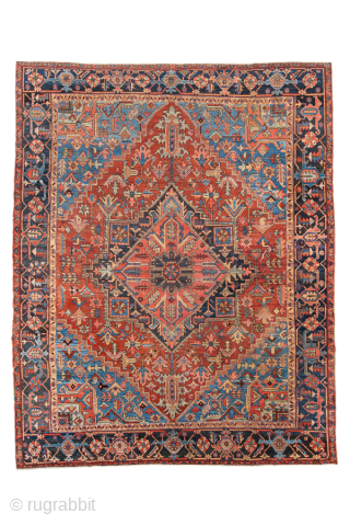 Antique Persian Heriz Rug, Circa 1900. Dramatic geometric medallion design woven in rich shades of brick red, navy blue, sky blue, and ivory. Impressive scale and vibrant palette create a powerful focal  ...