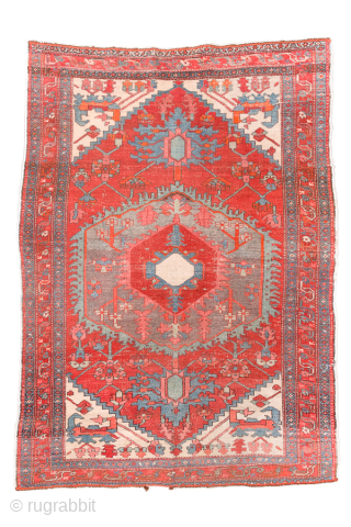 Antique Persian Serapi Rug, Circa 1900. Bold geometric medallion woven across a vibrant coral-red field with soft blue-gray accents and ivory corner spandrels. 

4'10" x 6'8"

Item No: 99486     