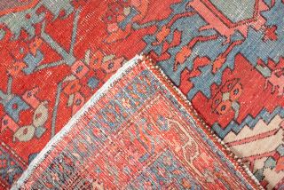 Antique Persian Serapi Rug, Circa 1900. Bold geometric medallion woven across a vibrant coral-red field with soft blue-gray accents and ivory corner spandrels. 

4'10" x 6'8"

Item No: 99486     