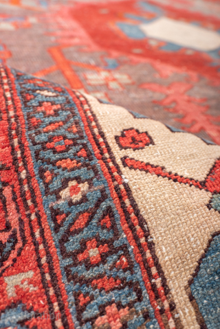 Antique Persian Serapi Rug, Circa 1900. Bold geometric medallion woven across a vibrant coral-red field with soft blue-gray accents and ivory corner spandrels. 

4'10" x 6'8"

Item No: 99486     