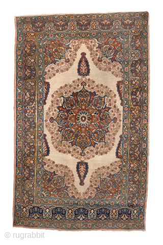 Antique Persian Tabriz Rug, Circa 1920. Beautifully detailed medallion design surrounded by elegant floral and arabesque motifs on a luminous ivory field. Sophisticated palette and balanced composition make it a versatile addition  ...