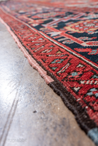 Antique Persian Serapi Carpet, Circa 1900. Striking elongated medallion set against a richly abrashed terracotta field framed by a deep navy border.
10'0" x 13'5"
Item No: 100255