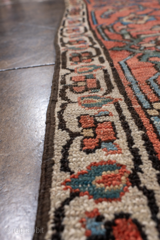 Antique Persian Serapi Carpet, Circa 1900. Striking midnight-blue stepped medallion on a rich terracotta field framed by vibrant red and ivory borders.

8'4" x 12'5"

Item No: 100874       