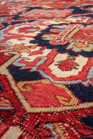 Antique Persian Serapi Carpet, Circa 1900. Bold crimson stepped medallion surrounded by ivory and sky-blue geometric motifs, framed by a richly detailed midnight-blue border.

10'0" x 12'5"

Item No: 101185     