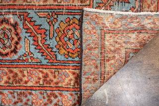 Antique Persian Bakhshayesh Carpet, Circa 1900. Features a softly aged camel field adorned with delicate repeating geometric floral motifs, framed by an elegant pale blue border.

9'0" x 12'2"

Item No: 101851   