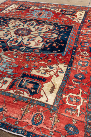 Antique Persian Serapi Carpet, Circa 1900. Bold ivory and indigo cruciform medallion surrounded by a vibrant brick-red field and framed by an intricately detailed geometric border.

10'1" x 12'6"

Item No: 88039   