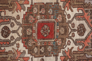 Antique Persian Serapi Carpet, Circa 1900. Features a rare walnut-brown field with a striking geometric medallion highlighted by ivory, muted blue, and terracotta accents.

9'9" x 12'4"

Item No: 98529     