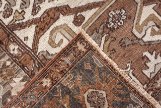 Antique Persian Serapi Carpet, Circa 1900. Features a rare walnut-brown field with a striking geometric medallion highlighted by ivory, muted blue, and terracotta accents.

9'9" x 12'4"

Item No: 98529     