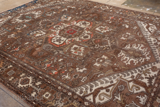 Antique Persian Serapi Carpet, Circa 1900. Features a rare walnut-brown field with a striking geometric medallion highlighted by ivory, muted blue, and terracotta accents.

9'9" x 12'4"

Item No: 98529     