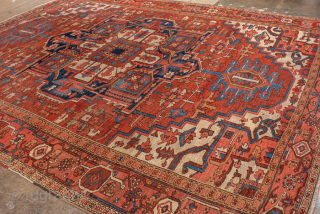 Antique Persian Serapi Carpet, Circa 1900. Commanding geometric medallion framed by a warm terracotta field and striking ivory spandrels.
10'8" x 13'7"
Item No: 99644