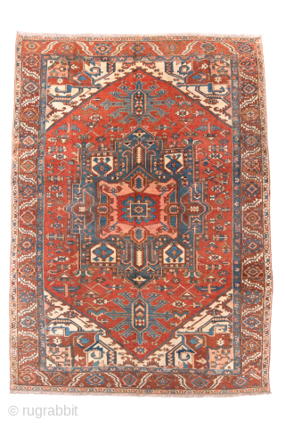 Antique Persian Serapi Carpet, Circa 1900. Striking stepped brick-red medallion surrounded by ivory and deep blue geometric motifs in the bold tribal style of the Heriz region.

9'1" x 12'5"

Item No: 99718  