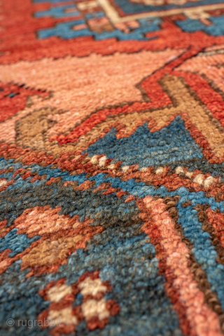 Antique Persian Serapi Carpet, Circa 1900. Striking stepped brick-red medallion surrounded by ivory and deep blue geometric motifs in the bold tribal style of the Heriz region.

9'1" x 12'5"

Item No: 99718  