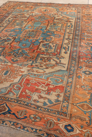 Antique Persian Serapi Carpet, Circa 1900. Features an elegant elongated medallion set within a warm coral-red field accented by soft ivory and muted blue details.

8'7" x 11'8"

Item No: 99930    