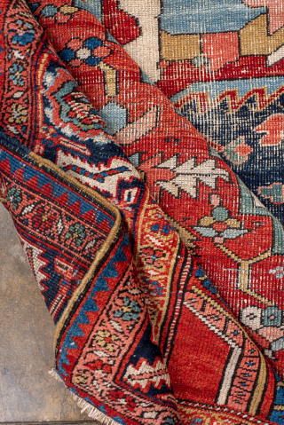 Antique Persian Serapi Carpet, Circa 1900. Dramatic stepped medallion surrounded by richly abrashed indigo and terracotta tones framed by an elegant navy border.

10'6" x 14'3"

Item No: 100500      