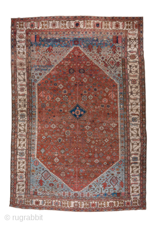 Antique Persian Serapi Carpet, Circa 1900. Rare, spacious design with a large terracotta lozenge medallion set against an ivory field accented by soft sky-blue spandrels.
11'5" x 16'8"
Item No: 59200