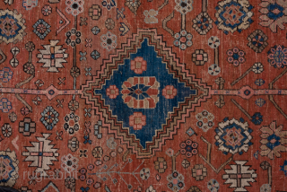 Antique Persian Serapi Carpet, Circa 1900. Rare, spacious design with a large terracotta lozenge medallion set against an ivory field accented by soft sky-blue spandrels.
11'5" x 16'8"
Item No: 59200