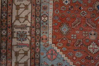 Antique Persian Serapi Carpet, Circa 1900. Rare, spacious design with a large terracotta lozenge medallion set against an ivory field accented by soft sky-blue spandrels.
11'5" x 16'8"
Item No: 59200