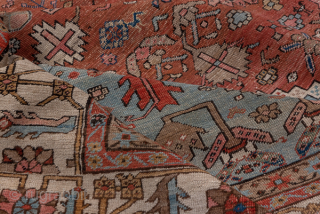Antique Persian Serapi Carpet, Circa 1900. Rare, spacious design with a large terracotta lozenge medallion set against an ivory field accented by soft sky-blue spandrels.
11'5" x 16'8"
Item No: 59200