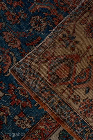 Antique Persian Serapi Carpet, Circa 1900. Dramatic oversized salmon-red medallion set against a richly detailed indigo field and framed by an elegant ivory border.
11'1" x 13'9"
Item No: 95849