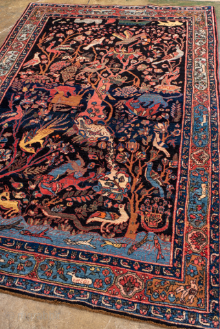 Antique Persian Bidjar Pictorial Rug, Circa 1920. Extraordinary Tree of Life design filled with birds, animals, flowering vines, and mythical creatures woven against a deep midnight blue field.

4'6" x 6'9"

Item No: 100617 