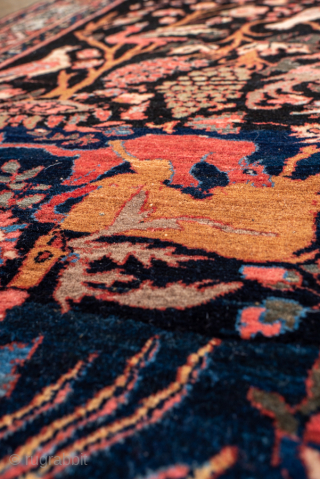 Antique Persian Bidjar Pictorial Rug, Circa 1920. Extraordinary Tree of Life design filled with birds, animals, flowering vines, and mythical creatures woven against a deep midnight blue field.

4'6" x 6'9"

Item No: 100617 