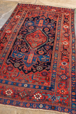 Antique Persian Bidjar Runner, Circa 1920. Bold geometric medallion design on a deep navy field framed by a vibrant crimson border with striking tribal motifs.
4'1" x 7'0"
Item No: 101222