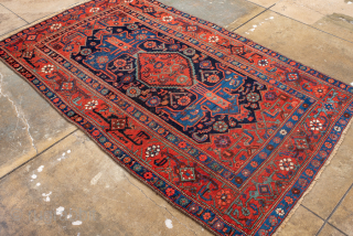 Antique Persian Bidjar Runner, Circa 1920. Bold geometric medallion design on a deep navy field framed by a vibrant crimson border with striking tribal motifs.
4'1" x 7'0"
Item No: 101222