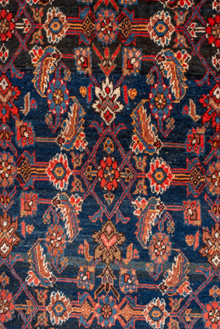 Antique Persian Bidjar Rug, Circa 1920. Elegant allover Herati design woven across a deep navy field, framed by warm camel spandrels and a vibrant sky-blue turtle border.
4'6" x 7'9"
Item No: 101378