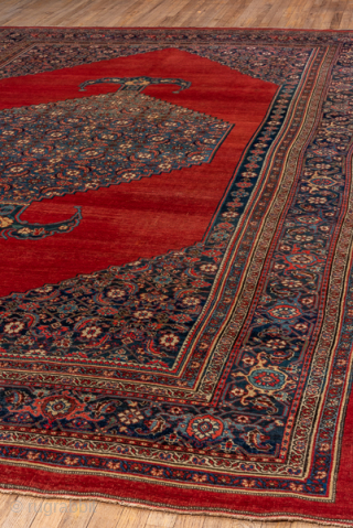 Antique Persian Bidjar Carpet, Circa 1910. Showcases a rare open crimson field centered by an elongated Herati medallion framed by finely detailed floral spandrels and an elegant navy border.

9'1" x 14'5"

Item No:  ...