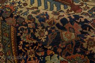 Antique Persian Bidjar Carpet, Circa 1910. Elegant ivory Herati field with an elongated rust diamond medallion framed by deep navy corner spandrels and a finely detailed floral border.
8'10" x 12'6"
Item No: 56181