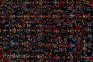 Antique Persian Bidjar Carpet, Circa 1920. Richly detailed midnight blue Herati medallion set within a terracotta field and framed by an elegant ivory turtle-palmette border.
4'10" x 7'7"
Item No: 95952