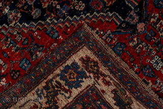 Antique Persian Bidjar Carpet, Circa 1920. Richly detailed midnight blue Herati medallion set within a terracotta field and framed by an elegant ivory turtle-palmette border.
4'10" x 7'7"
Item No: 95952