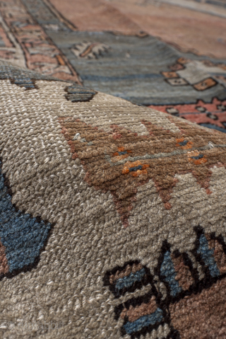 Antique Persian Serapi Carpet, Circa 1900. Features a spacious terracotta field with a striking geometric medallion and softly faded blue spandrels framed by an elegant ivory border.
10'3" x 12'7"
Item No: 97751