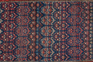Antique Persian Bidjar Runner, Circa 1920. Finely woven allover Herati pattern set against a deep indigo field framed by crisp ivory and crimson floral borders.
3'7" x 13'9"
Item No: 99096