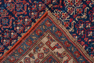 Antique Persian Bidjar Runner, Circa 1920. Finely woven allover Herati pattern set against a deep indigo field framed by crisp ivory and crimson floral borders.
3'7" x 13'9"
Item No: 99096