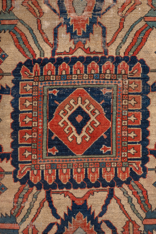 Antique Persian Serapi Carpet, Circa 1900. Features a commanding cruciform medallion set within a richly abrashed terracotta field framed by ivory spandrels and a bold geometric border.
12'8" x 18'10"
Item No: 99818