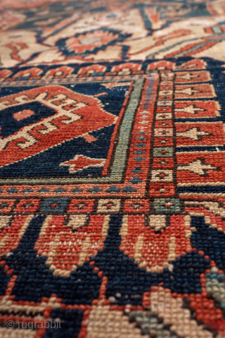 Antique Persian Serapi Carpet, Circa 1900. Features a commanding cruciform medallion set within a richly abrashed terracotta field framed by ivory spandrels and a bold geometric border.
12'8" x 18'10"
Item No: 99818