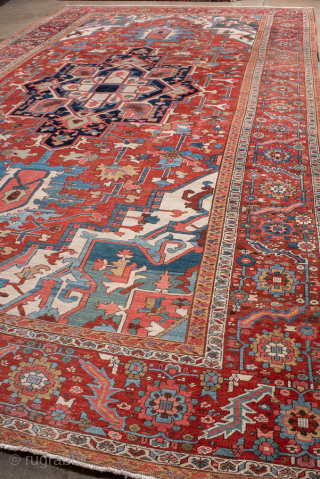 Antique Persian Serapi Carpet, Circa 1900. Striking elongated medallion set within a richly abrashed terracotta field highlighted by soft sky-blue accents and an elegant floral border.
11'0" x 20'0"
Item No: 99846