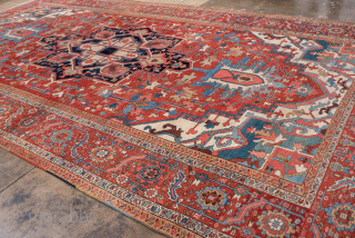 Antique Persian Serapi Carpet, Circa 1900. Striking elongated medallion set within a richly abrashed terracotta field highlighted by soft sky-blue accents and an elegant floral border.
11'0" x 20'0"
Item No: 99846