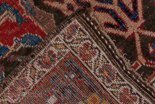 Antique Persian Bidjar Carpet, Circa 1920. Striking tribal composition with three elongated latch-hook medallions surrounded by bold geometric motifs woven in rich crimson and deep indigo.
3'9" x 7'2"
Item No: 36872